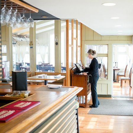 Waitress entering an order into computer